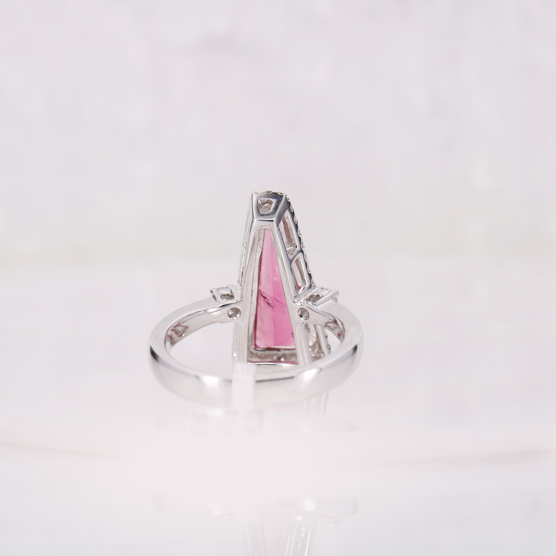 18ct white gold pink tourmaline and diamond ring. Faceted bright pink tourmaline and diamond ring.