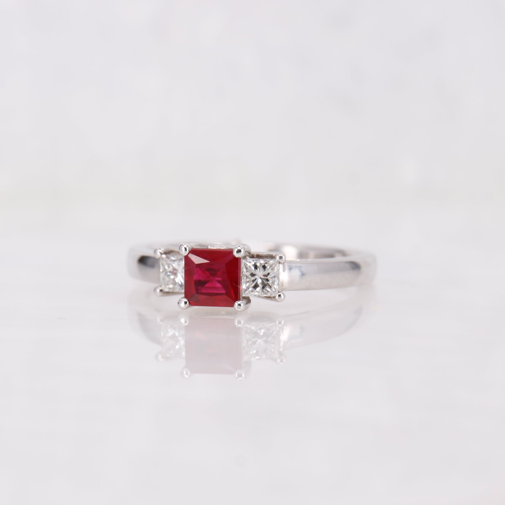 Ruby and Diamond trilogy ring. Set in 18ct white gold, princess cut ruby and diamond ring. 