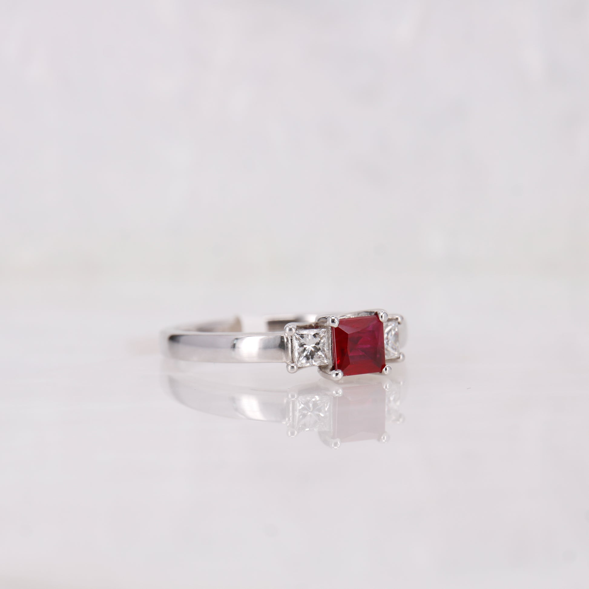 Ruby and Diamond trilogy ring. Set in 18ct white gold, princess cut ruby and diamond ring. 