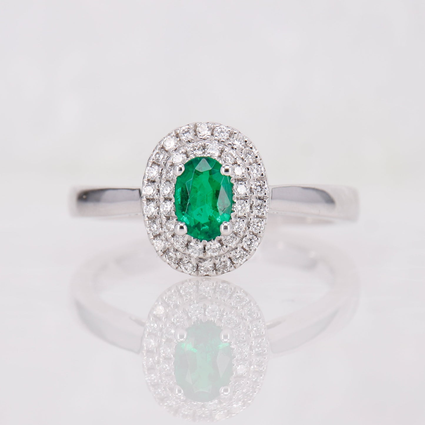 Oval Emerald Cut and double Halo Diamond Ring, set in 18ct White gold. 