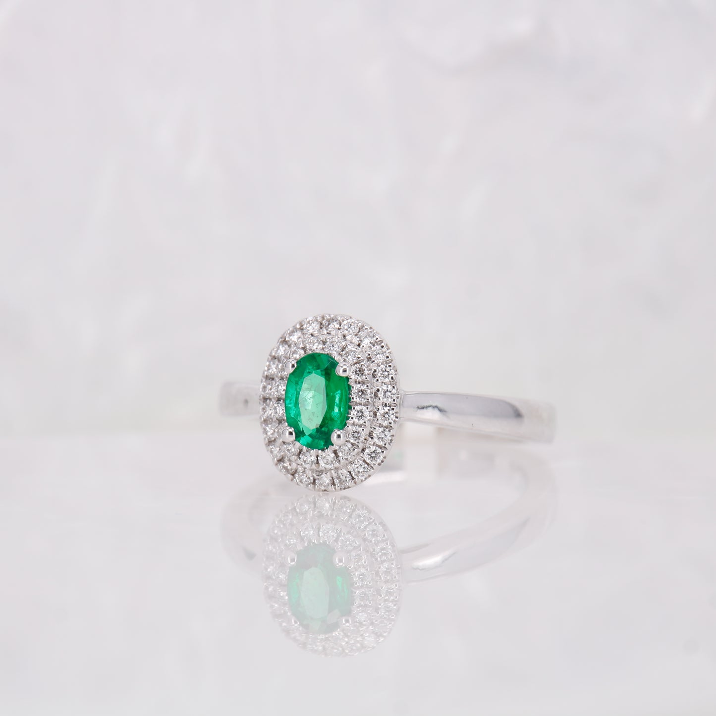 Oval Emerald Cut and double Halo Diamond Ring, set in 18ct White gold. 
