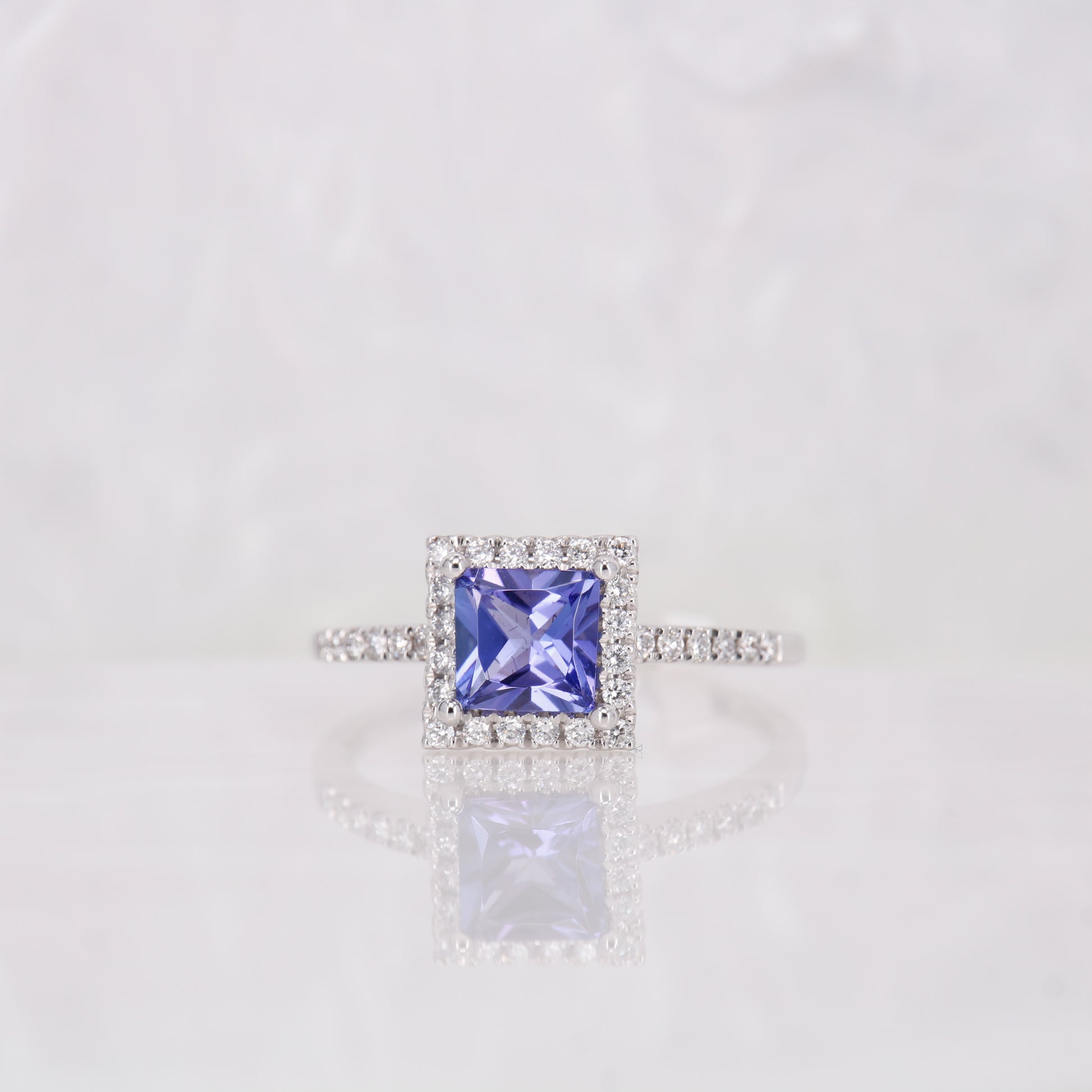 Tanzanite and Diamond Engagement Ring, set in 18ct white gold diamond halo. Princess cut tanzanite. 