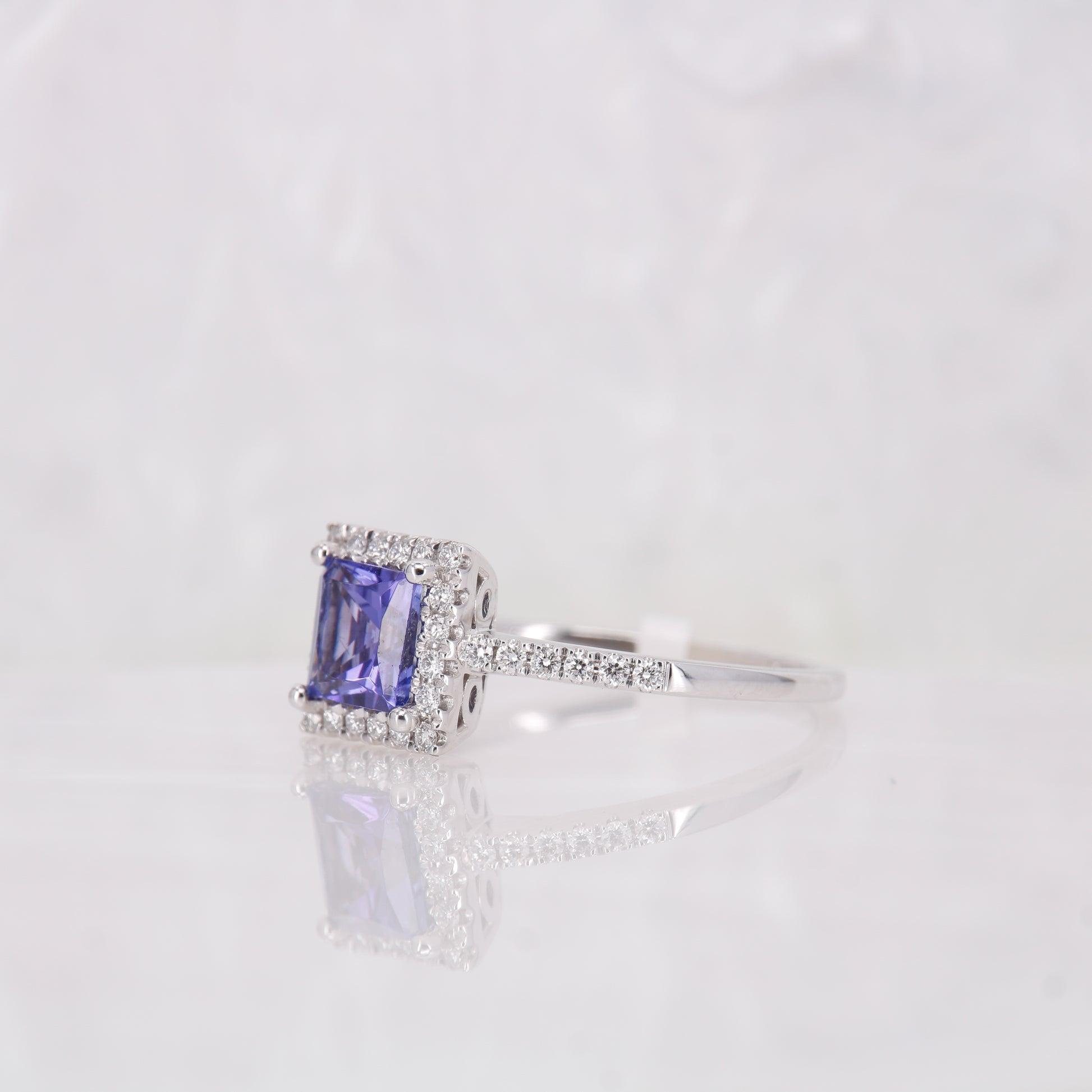 Tanzanite and Diamond Engagement Ring, set in 18ct white gold diamond halo. Princess cut tanzanite. 