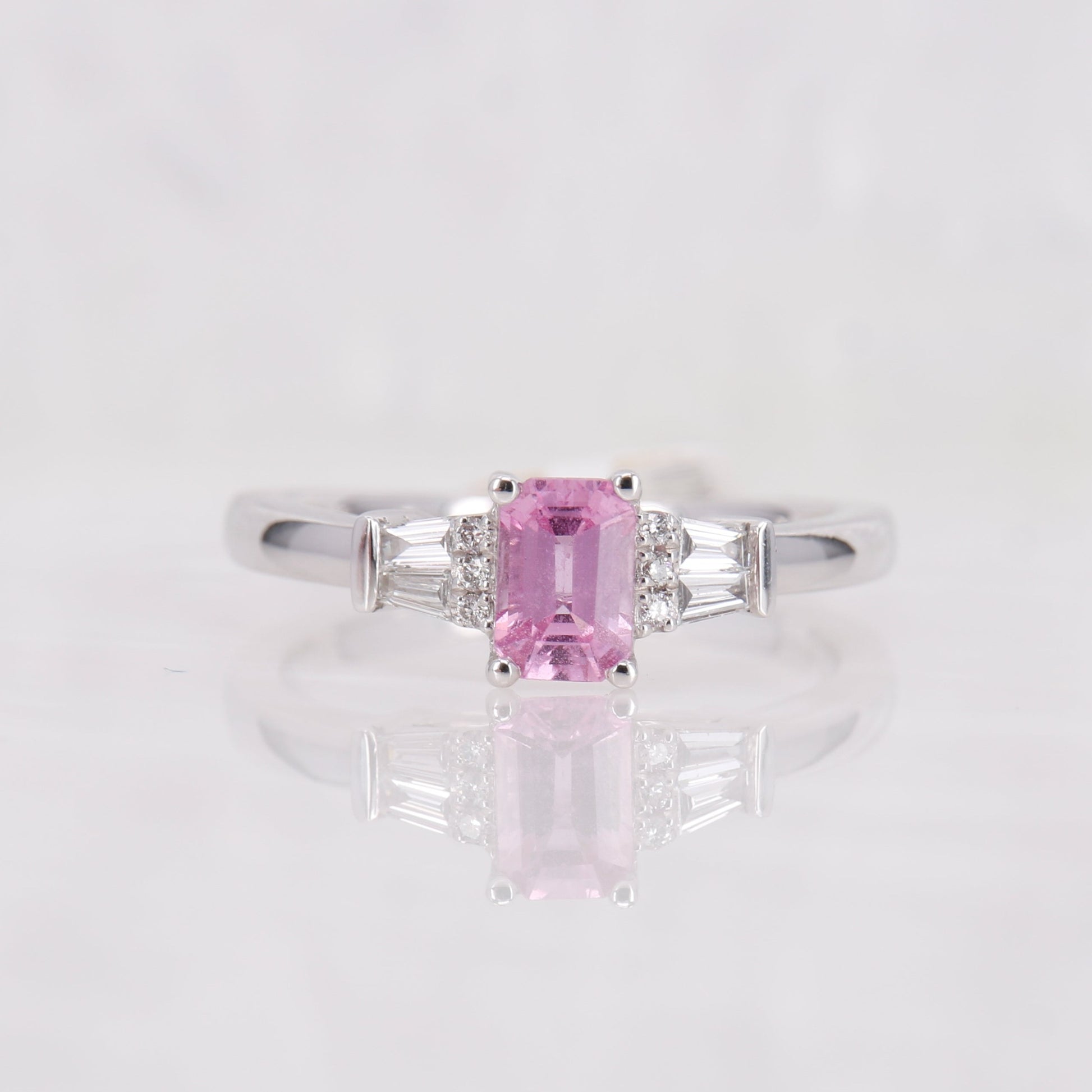 Pink Sapphire and Diamond Ring set in Platinum. Tapered baguette side stones. 