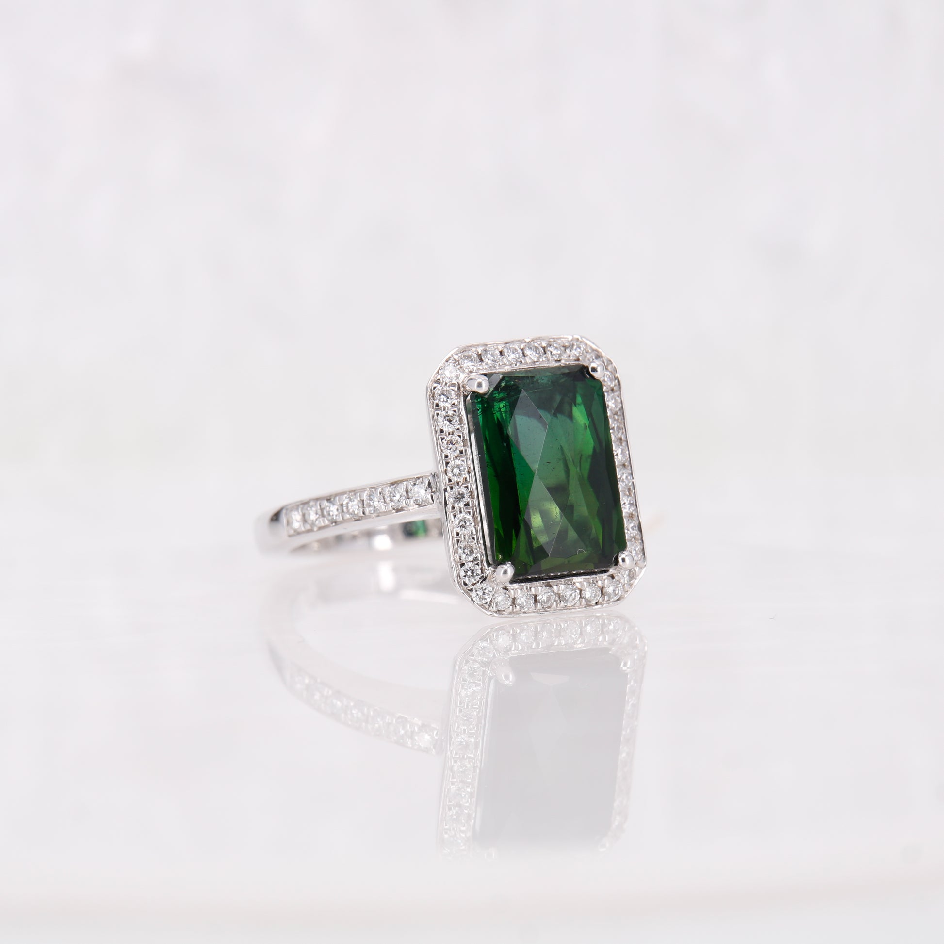 Green Tourmaline and Diamond Halo ring. 18ct white gold tourmaline and diamond ring.