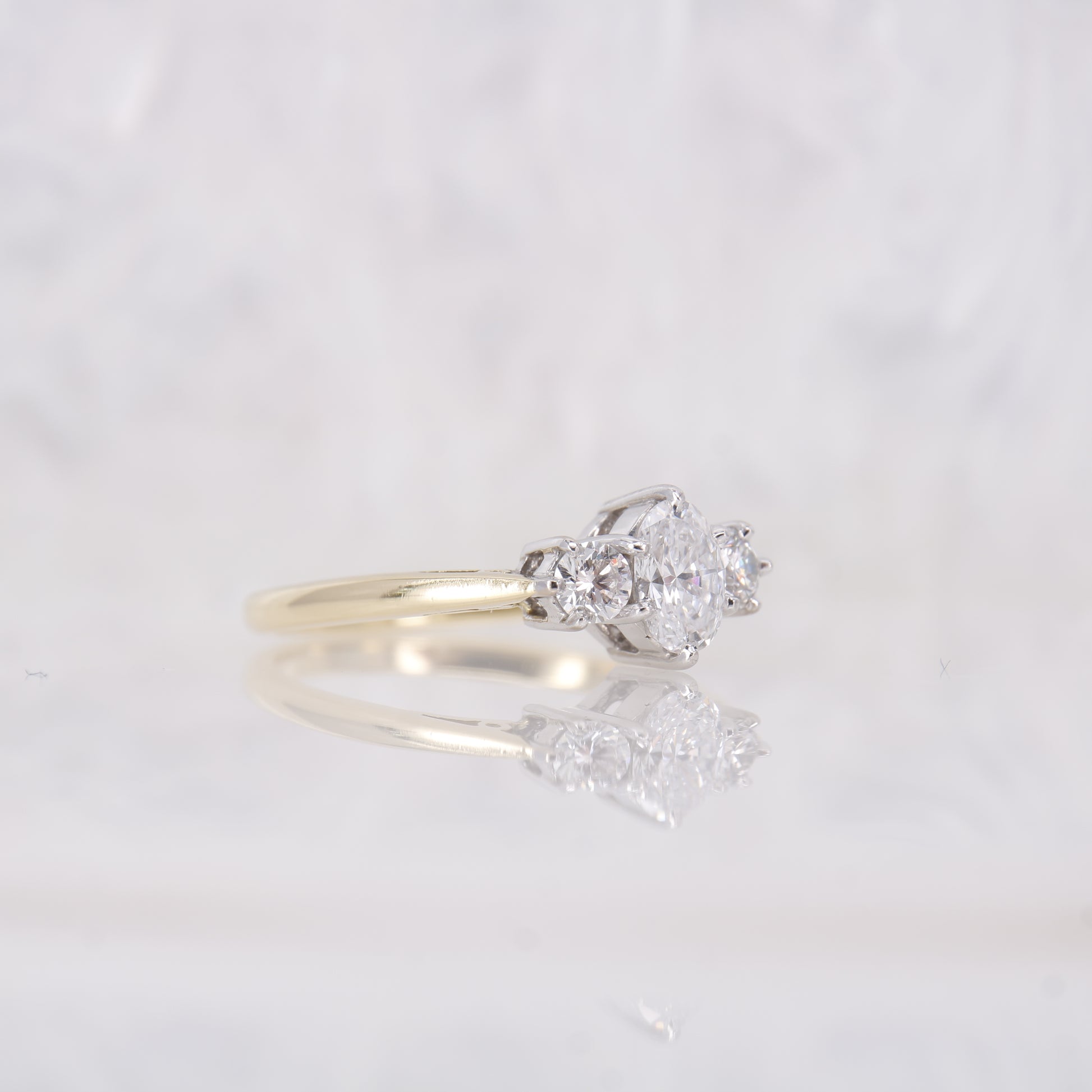 18ct yellow gold oval diamond engagement ring. Three stone oval diamond engagement ring. 