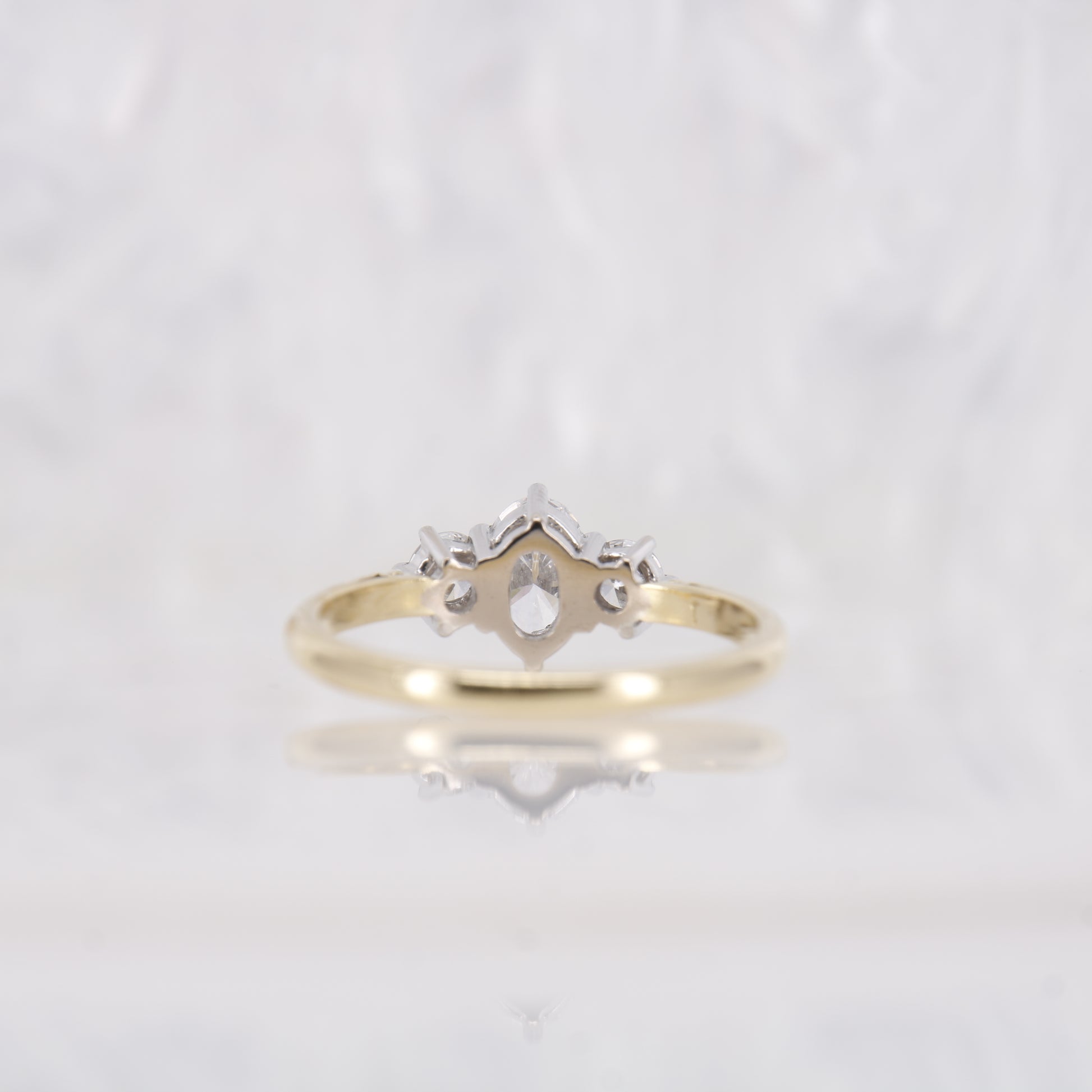 18ct yellow gold oval diamond engagement ring. Three stone oval diamond engagement ring. 