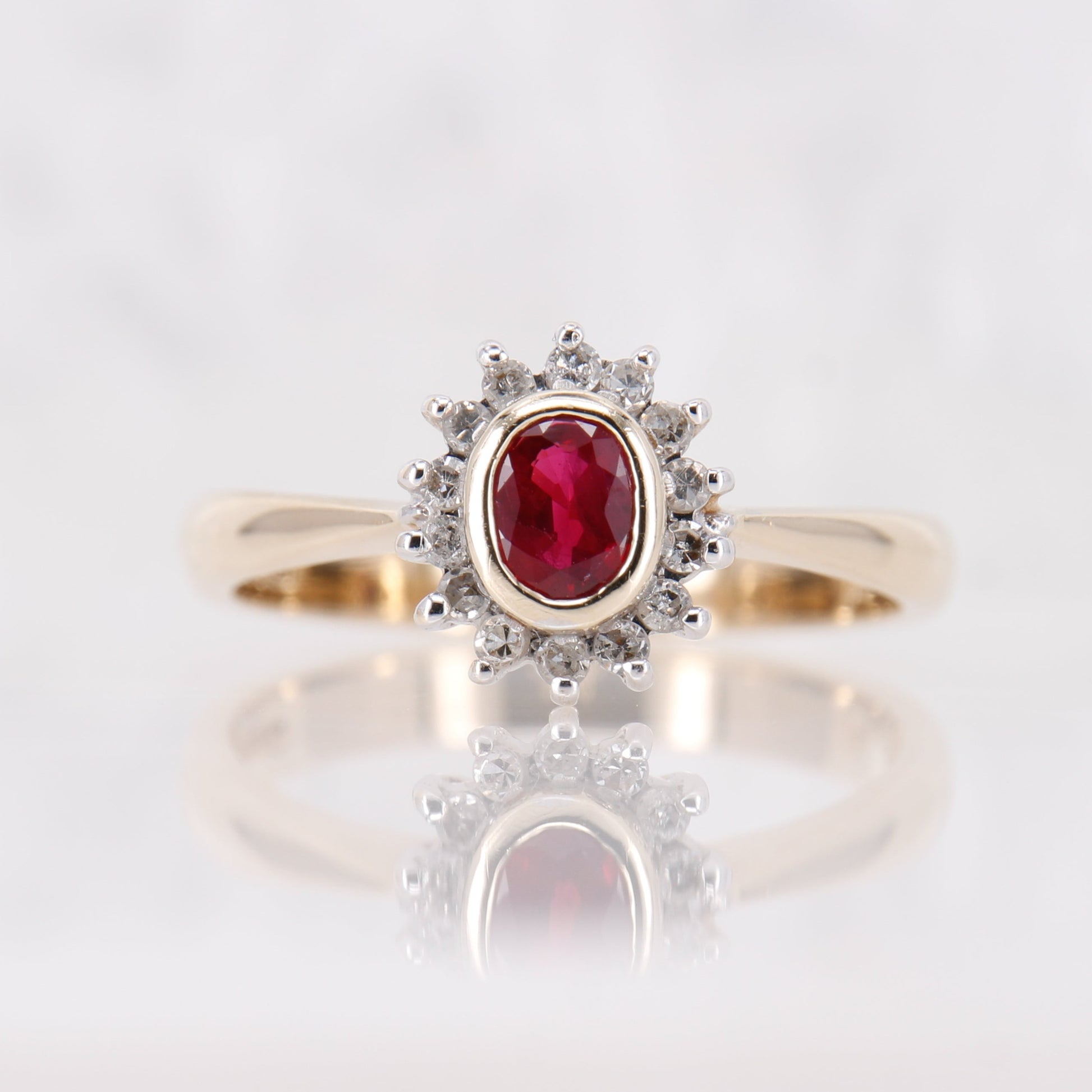 Vintage Garnet and Diamond Ring, Oval Cut Garnet surrounded by a halo of diamonds set in 9ct yellow gold. January birthstone engagement ring.