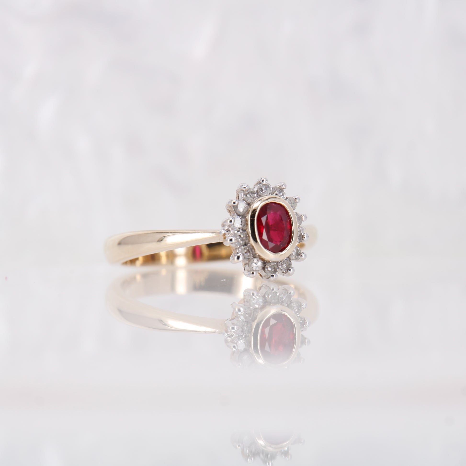 Vintage Garnet and Diamond Ring, Oval Cut Garnet surrounded by a halo of diamonds set in 9ct yellow gold. January birthstone engagement ring.