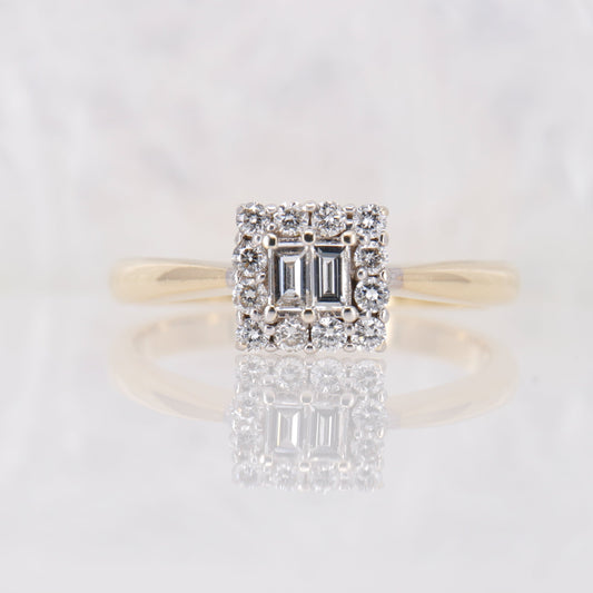 Secondhand Emerald Cut Diamond Engagement Ring. Twin Emerald cut diamond surrounded by a halo set in 18ct yellow gold. Vintage diamond engagement ring.