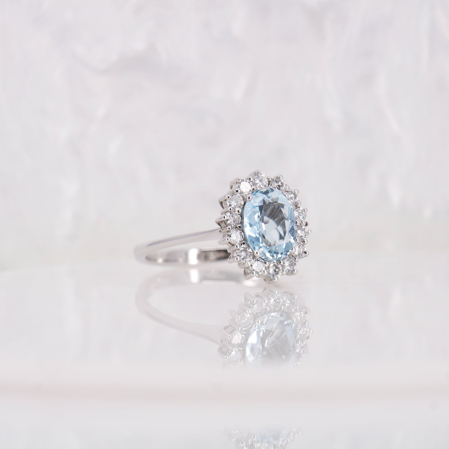Vintage Secondhand Aquamarine and Diamond Engagement Ring 18ct white gold oval cut aquamarine with a halo of diamonds