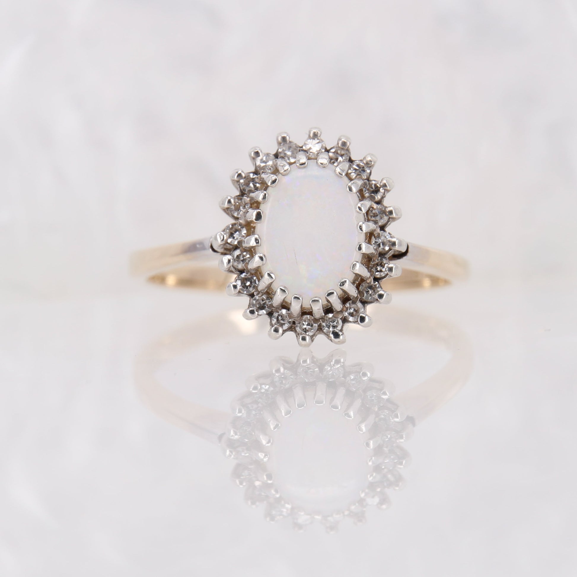 Vintage Opal and Diamond Ring in yellow gold. Secondhand white opal ring with a halo of diamonds.