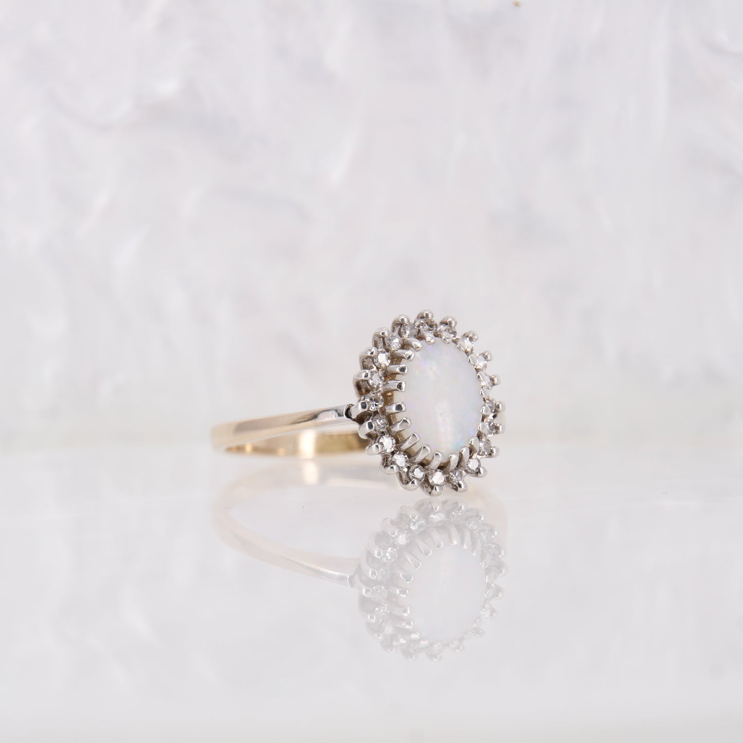 Vintage Opal and Diamond Ring in yellow gold. Secondhand white opal ring with a halo of diamonds.