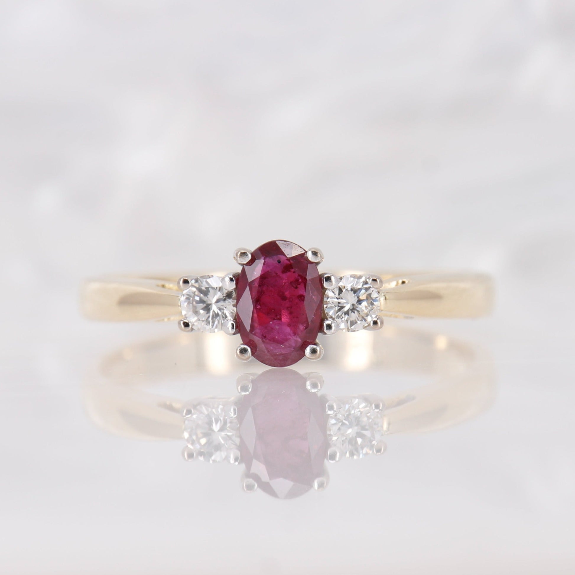Preowned Oval cut Ruby and Diamond Trilogy Three Stone Engagement Ring