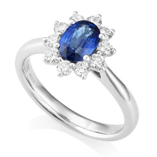 A timeless classic, an Oval Cut Sapphire and Diamond Halo.&nbsp;The beautiful 0.59-carat oval-cut sapphire takes centre stage, surrounded by a flower halo of 0.33 carats of diamonds. Crafted in luxurious platinum for a durable yet vintage inspired.